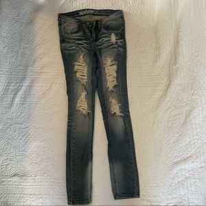 Very distressed Machine Jeans